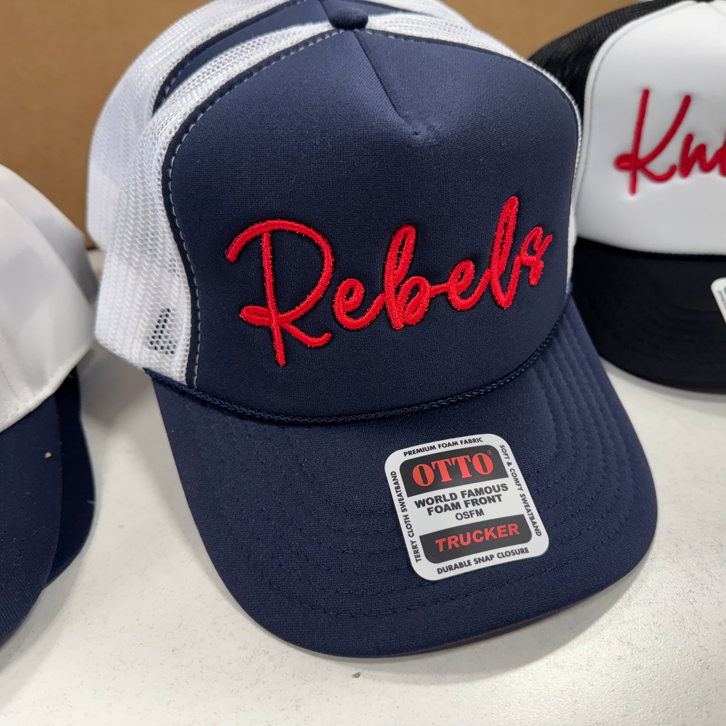 Rebels Scripty Embroidered Trucker - Navy/White
